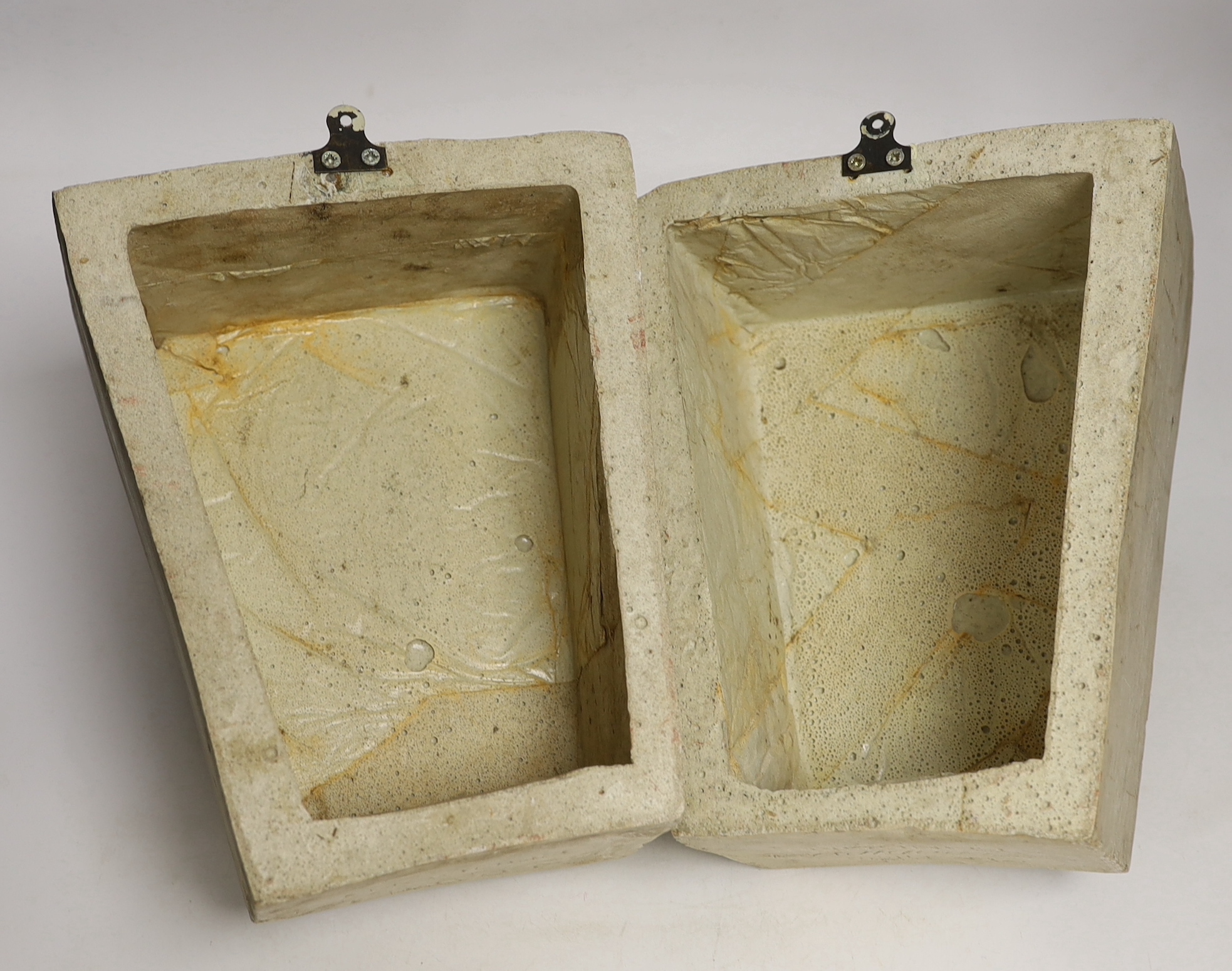 A pair of cast resin key stones, the underside reads COADE’S Lithodipyra LONDON, 25cm